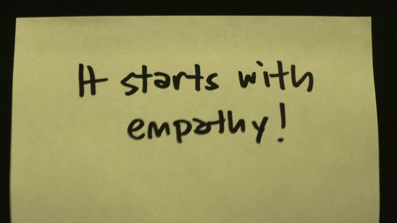 handwritten post it note: it starts with empathy!